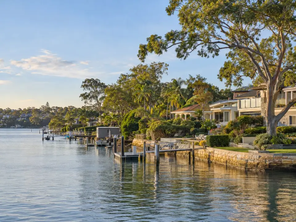 Waterfront homes and mature trees along the Parramatta River in Drummoyne