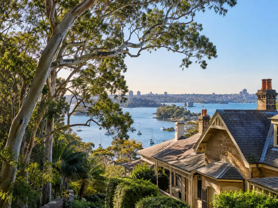 Mature trees around heritage homes near the harbour in North Sydney