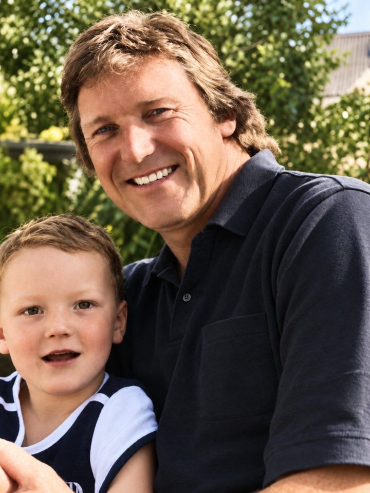 Robert de Jong, founder of Arbor Express, smiling outdoors with his son Alex in a leafy garden